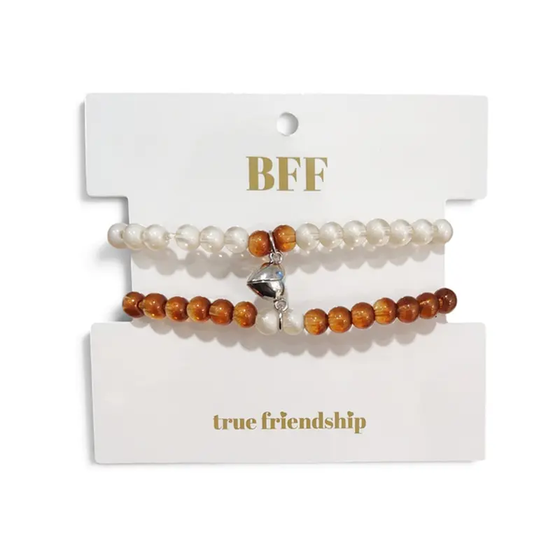 Set Pulseras Elasticas Blanca y Caramelo Unidas por Corazon Plateado