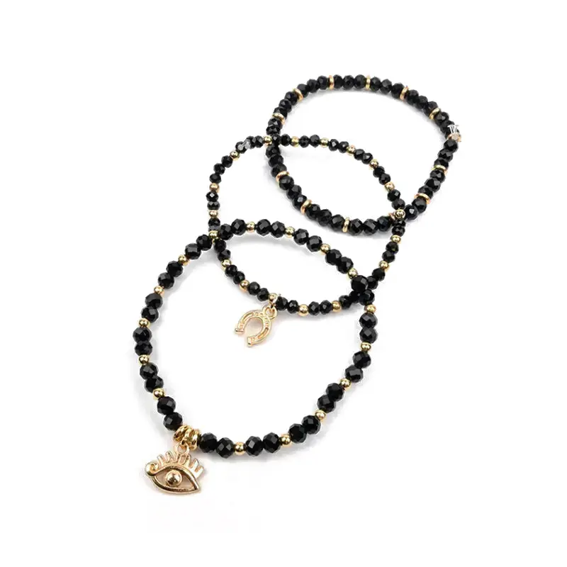 Set Tres Pulseras Elasticas Negras con Dijes Dorados